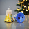 2 mundblæste juleklokker med sne i gul og blå
